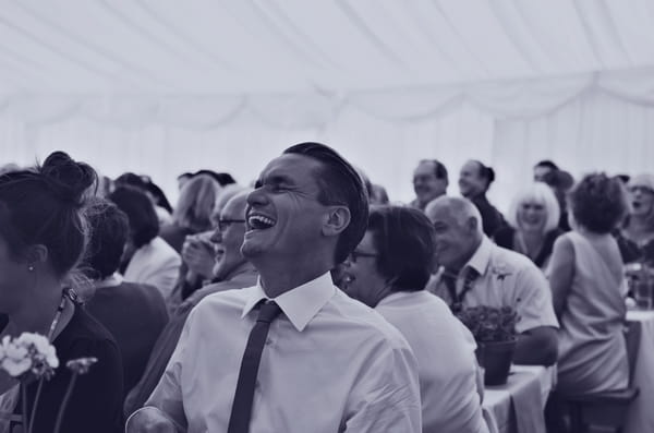 Wedding guest laughing at speech