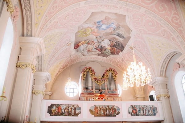 Church organ and ceiling with painting