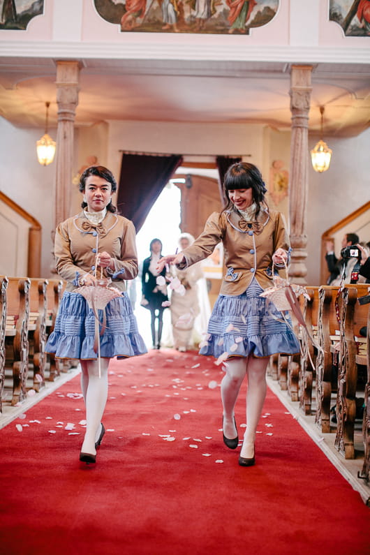 Bridesmaids walking down the aisle