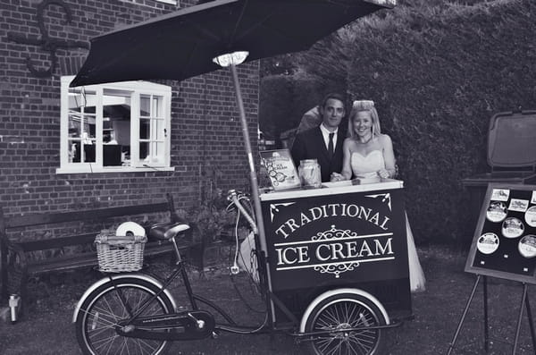 Bride and groom by ice cream cart