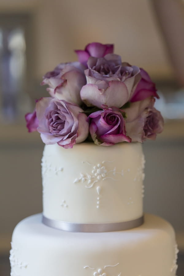 Flowers on top of wedding cake