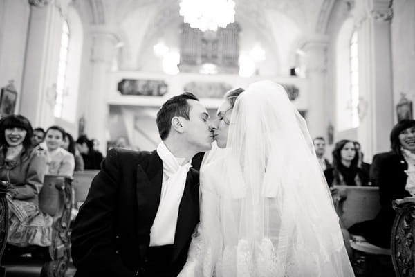 Bride and groom kiss