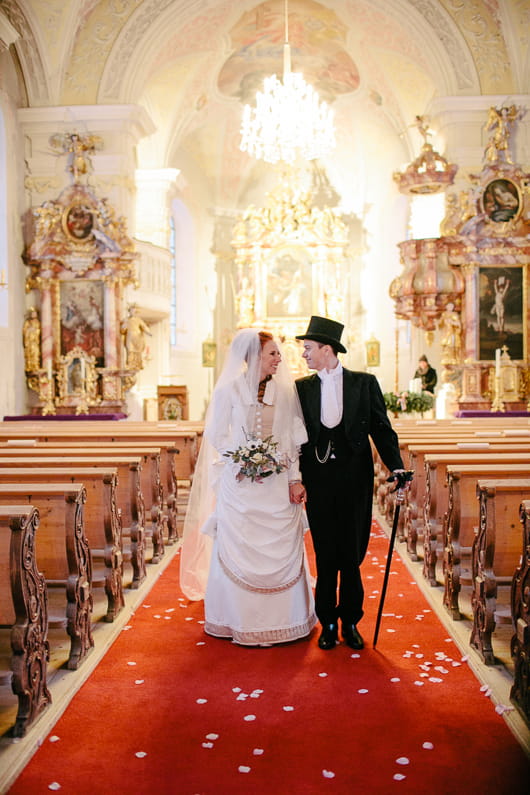 Bride and groom leave wedding ceremony