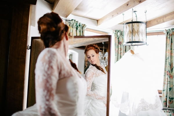 Bride looking in mirror