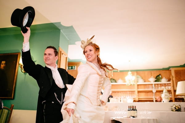 Bride and groom enter wedding breakfast