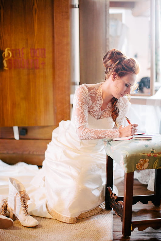 Bride writing message in book