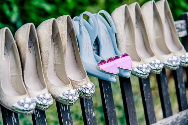 Bridal shoes on back of bench