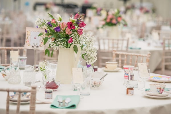 Jug of flowers on wedding table