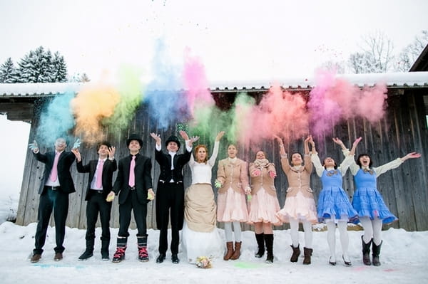 Bridal party throwing colourful holi powder in the air