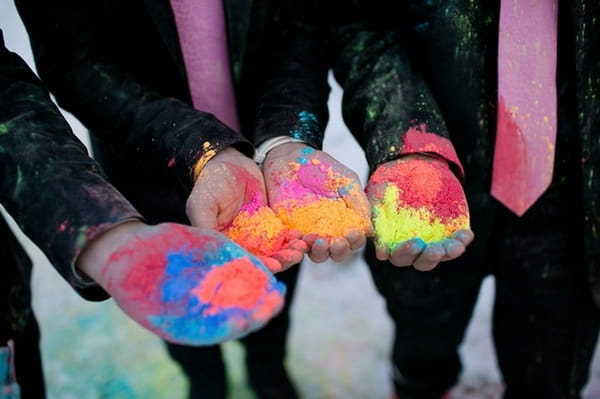 Groomsmen's hands full of holi powder