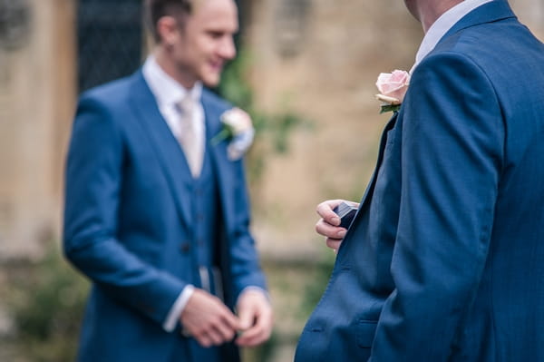 Best man holding wedding ring box