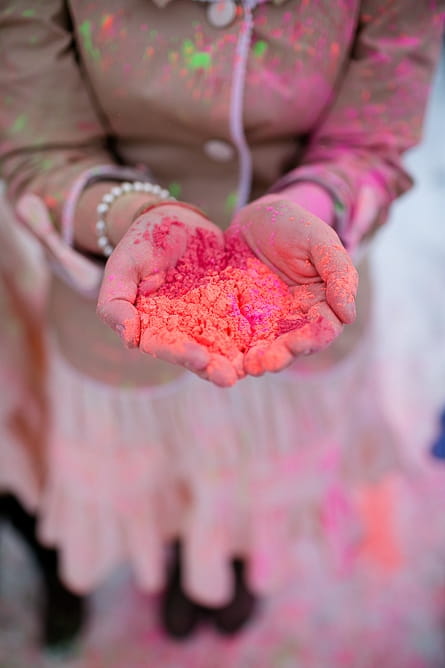 Bridesmaid holding holi powder