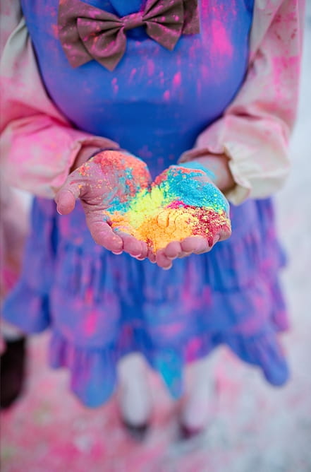 Bridesmaid holding holi powder