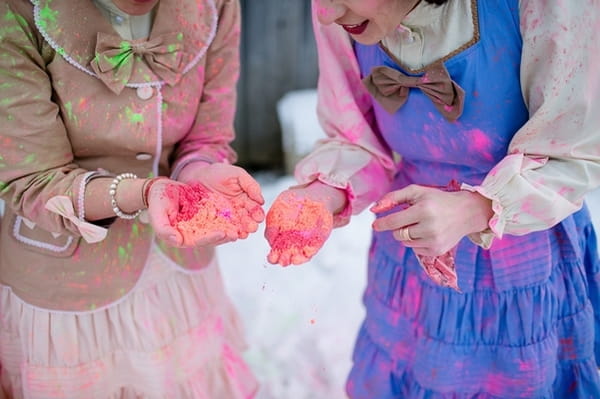 Bridesmaids holding holi powder