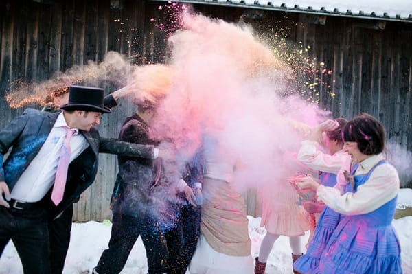 Bridal party throwing holi powder at each other