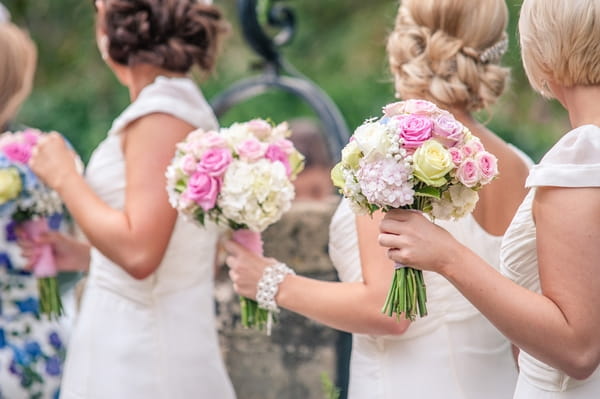 Bridesmaids holding bouquets