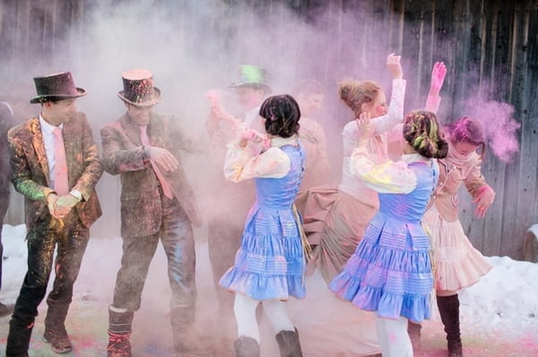 Bridal party throwing holi powder at each other