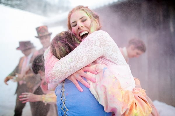 Bride hugging bridesmaid