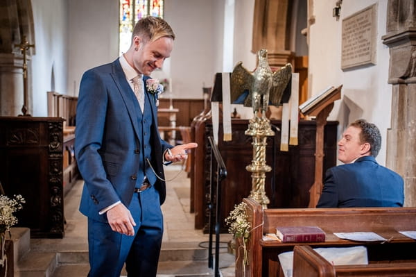 Groom checking pocket watch