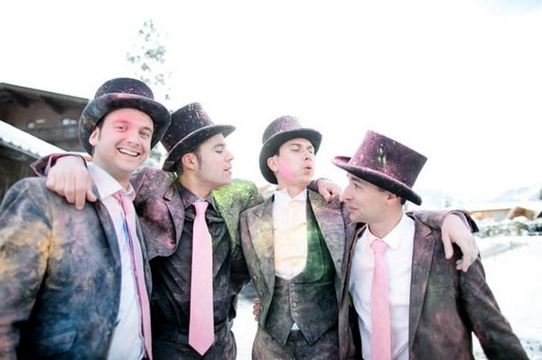 Groomsmen covered in holi powder