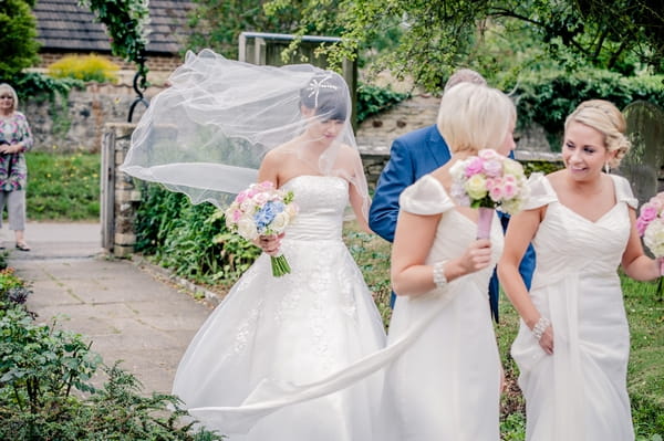 Bride walking into church