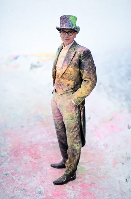 Groom covered in holi powder