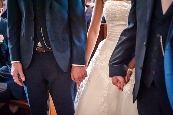 Bride and groom holding hands