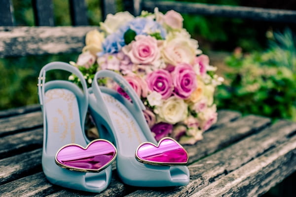 Blue bridal shoes and bouquet