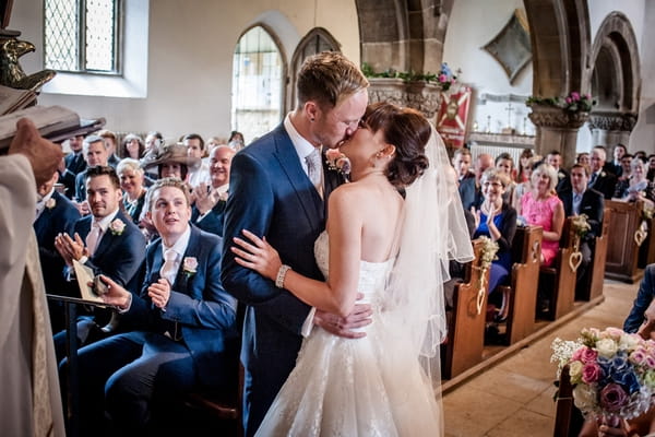 Bride and groom kiss