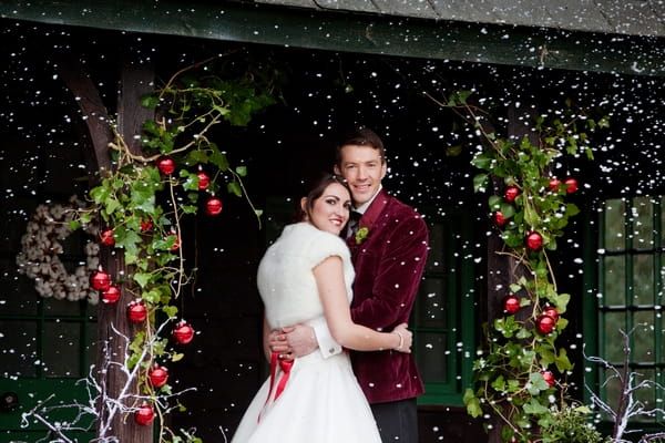 Bride and groom with snow