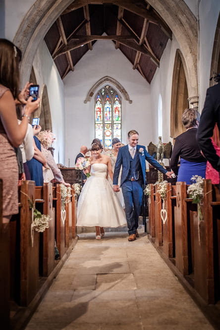 Bride and groom leaving church