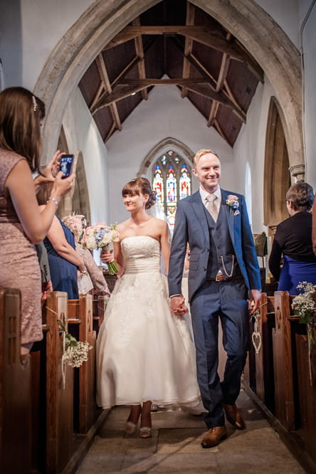 Bride and groom leaving church