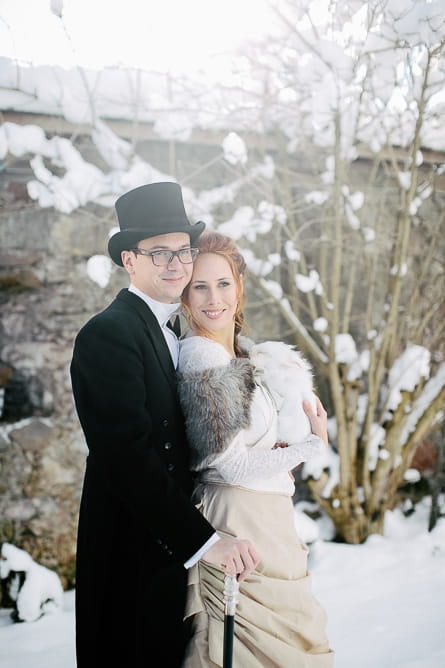 Bride and groom holding rabbit