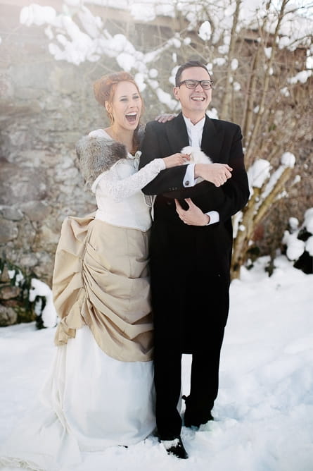 Bride and groom holding rabbit