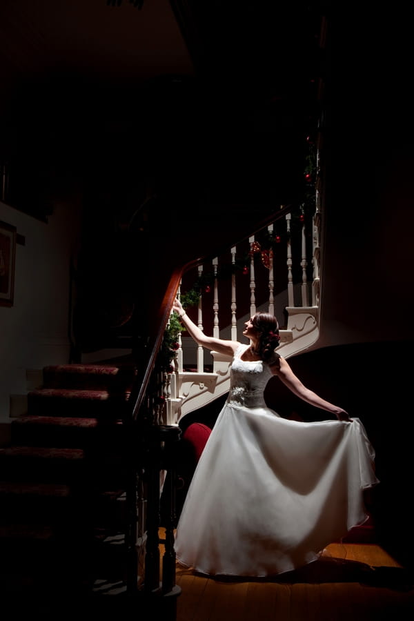 Bride standing by stairs