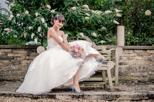 Bride sitting on bench