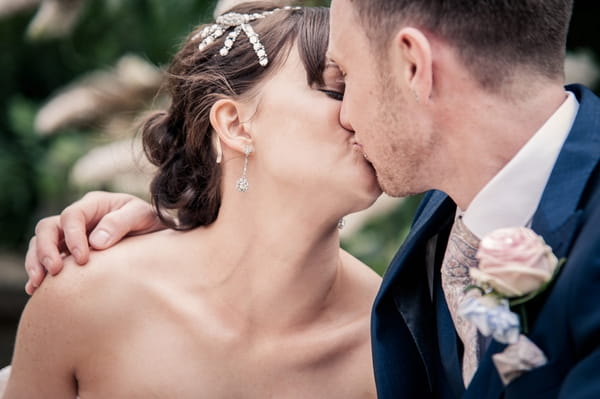 Bride and groom kissing