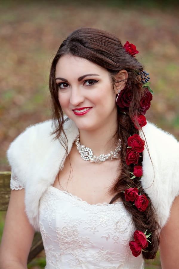 Bride with long hair plait with roses