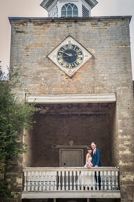 Bride and groom on balcony