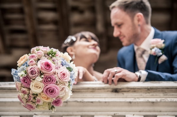 Bride's bouquet over balcony