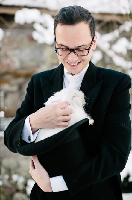 Groom holding rabbit