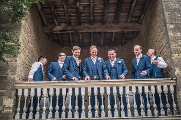 Groomsmen on balcony