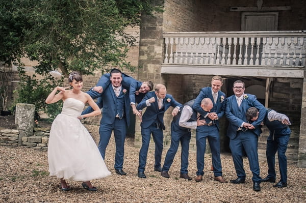 Bride and groomsmen in funny poses