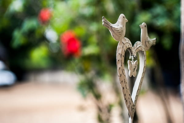 Heart with birds on gate