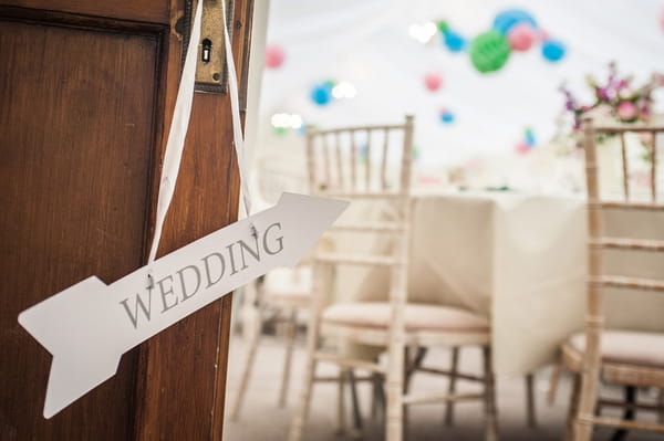 Wedding arrow hanging from door