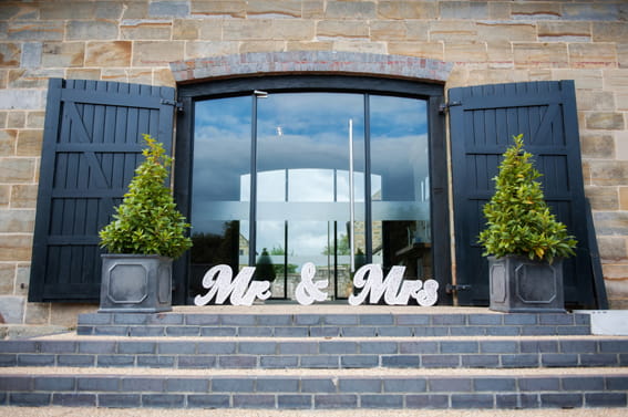 Mr and Mrs letters outside Hendall