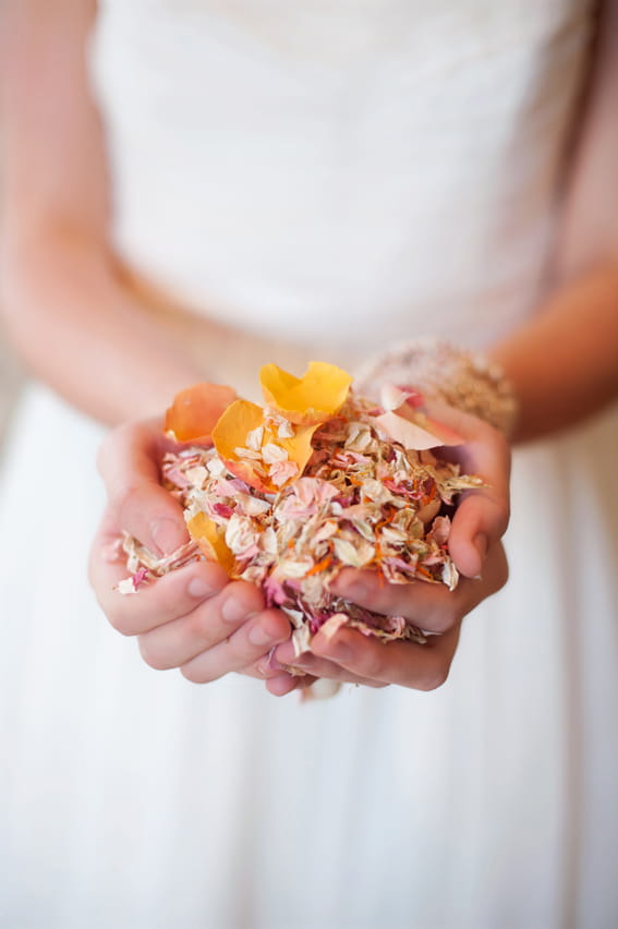 Bride holding confetti in her hands