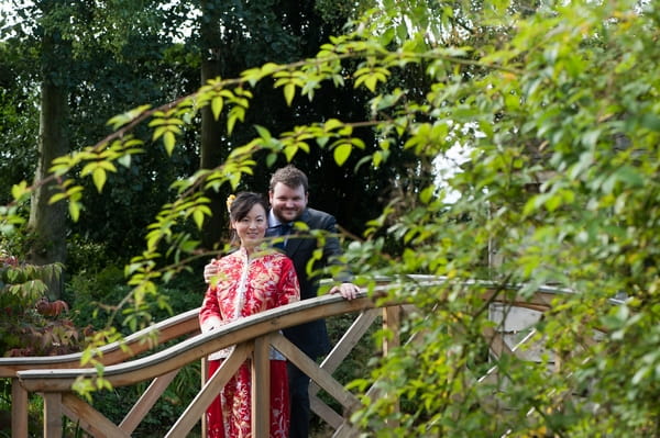 Bride and groom on bridge