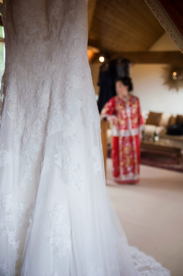 Wedding dress with bride in background