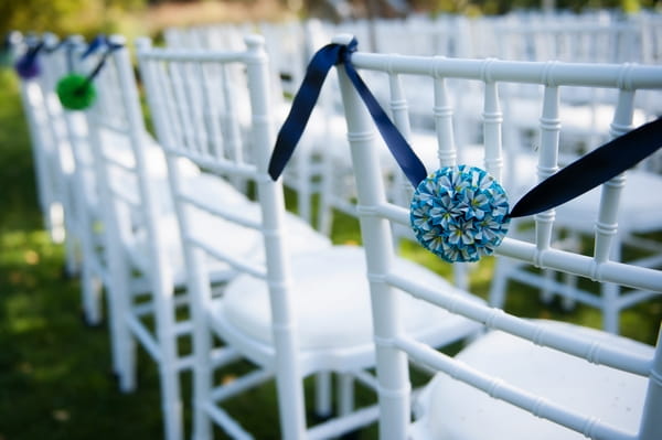 Wedding ceremony chairs with pom poms